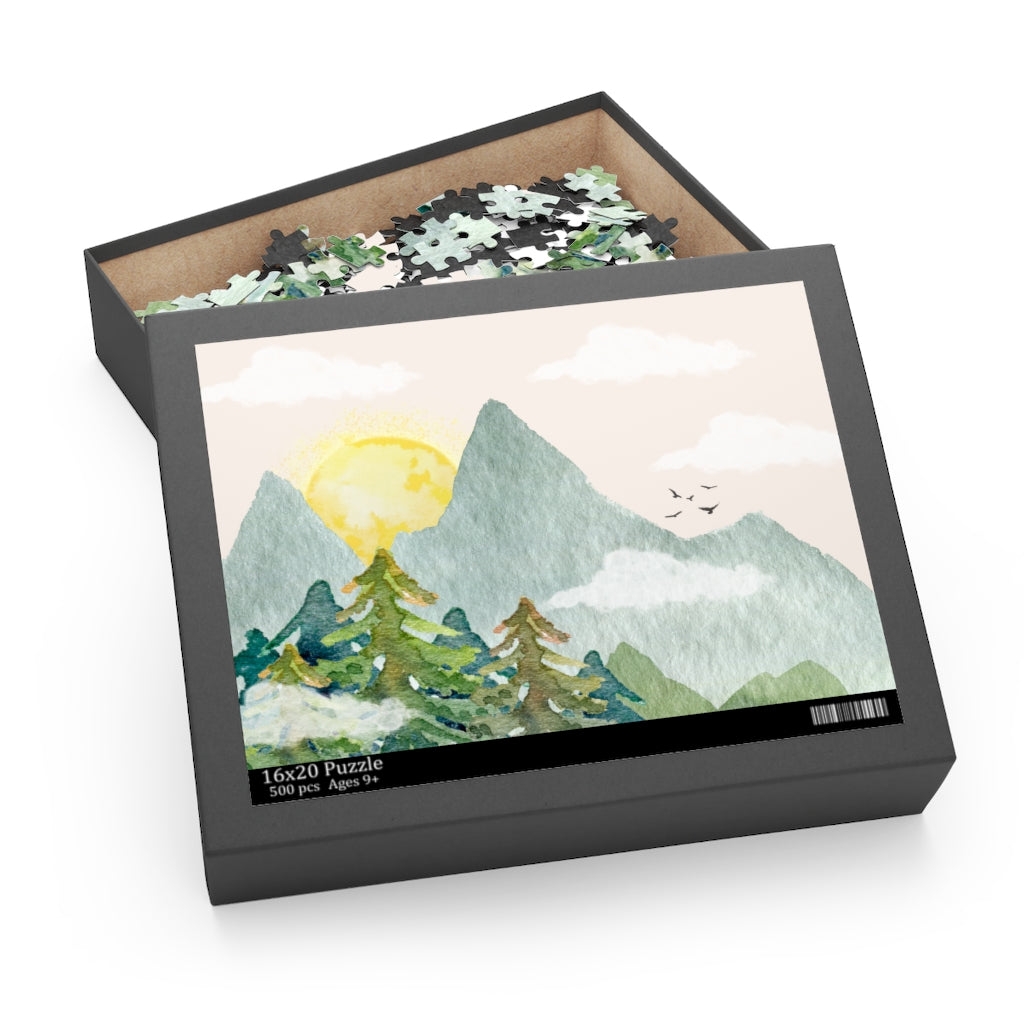 Jigsaw puzzle box with mountain and sun design on a white background