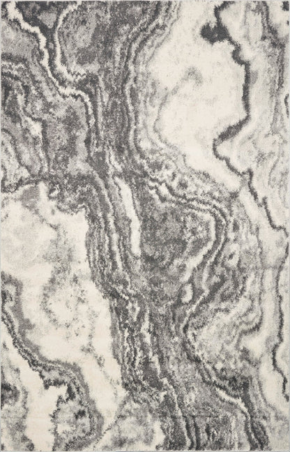 Close-up of a marble-like texture with swirling patterns in gray and white.
