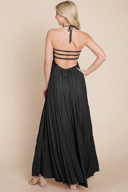 Women wearing a SMOCKED BOHO MAXI WITH PLEATS & OPEN BACK