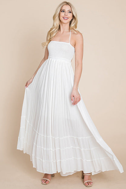 Women wearing a white SMOCKED BOHO MAXI WITH PLEATS & OPEN BACK