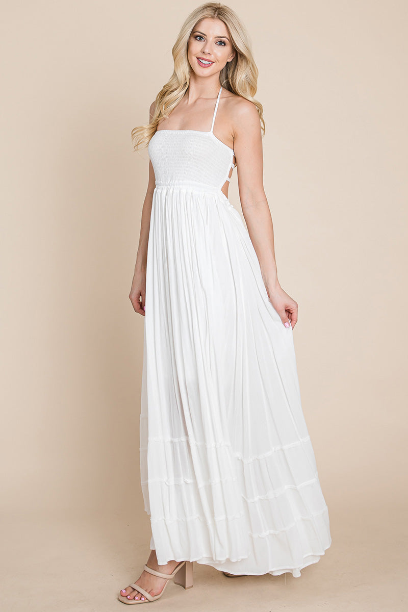 Women wearing a WHITE SMOCKED BOHO MAXI WITH PLEATS & OPEN BACK