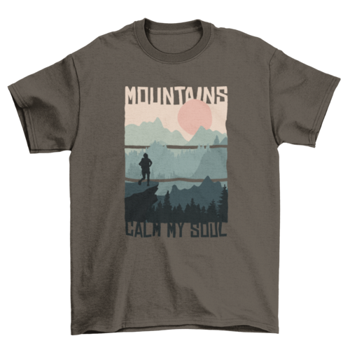 A dark green men's t-shirt with a graphic print of mountains and the text 'MOUNTAINS' above the image.