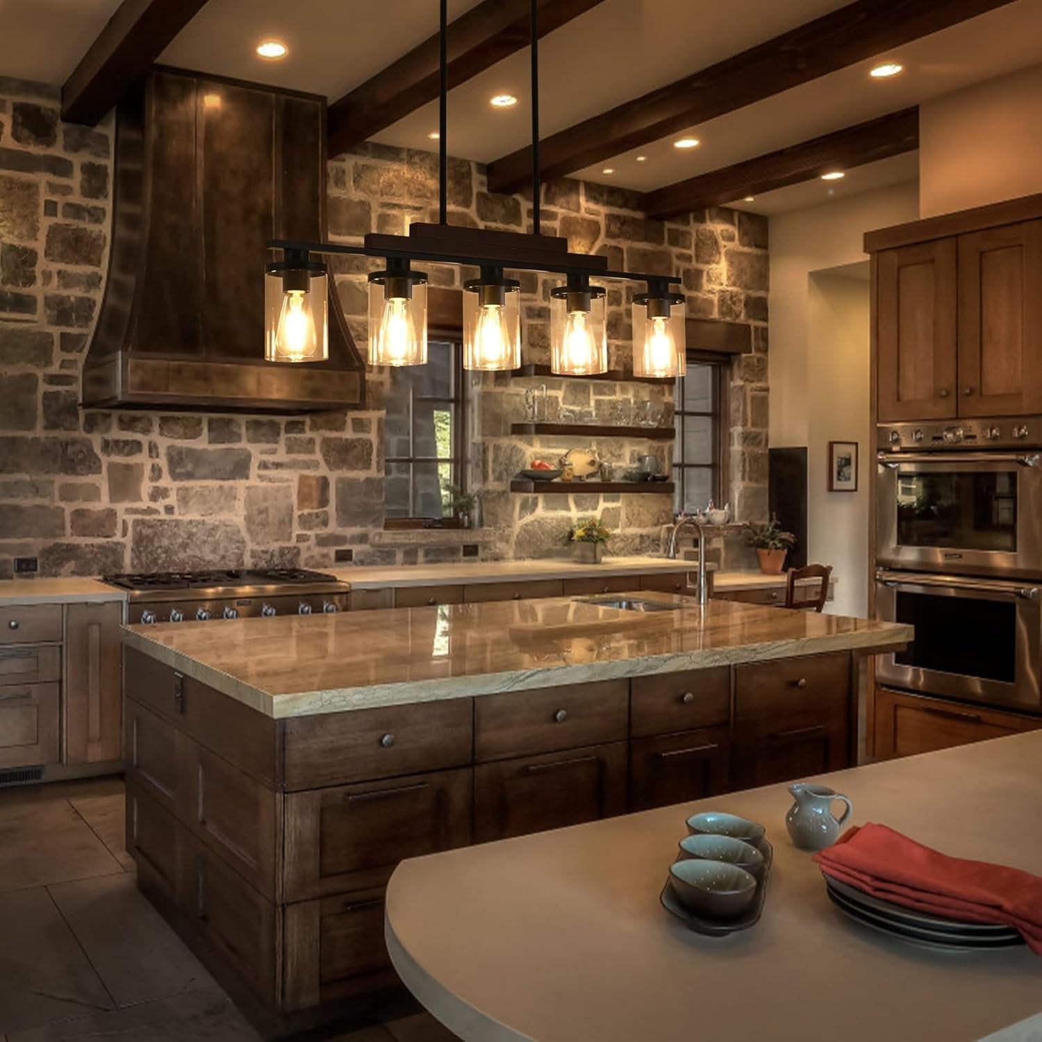 Modern kitchen with stone wall, wooden cabinets, and island.
