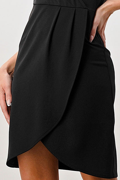 Black skirt worn by a person on a white background
