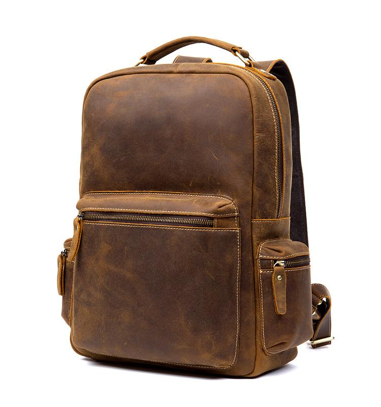 Brown leather backpack on a white background