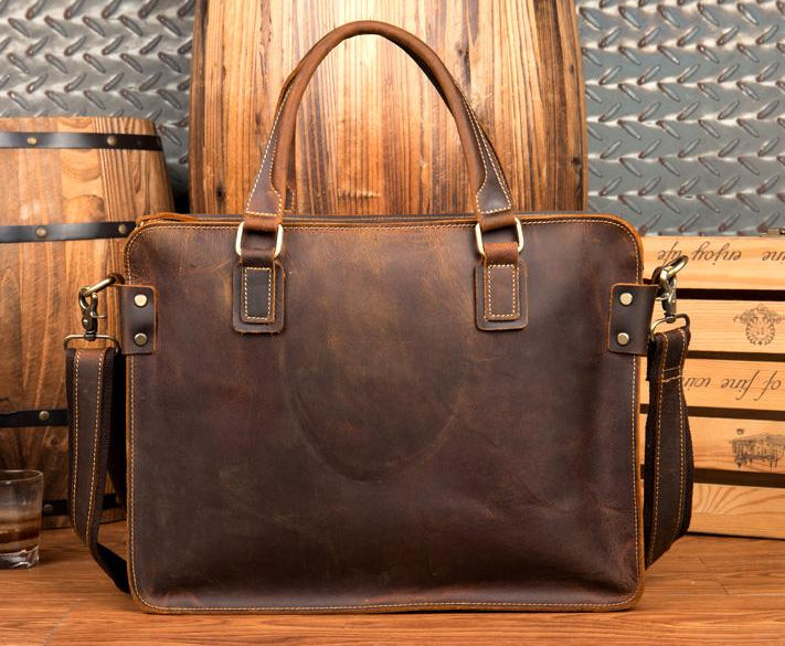 Brown leather briefcase on a wooden surface with a rustic background